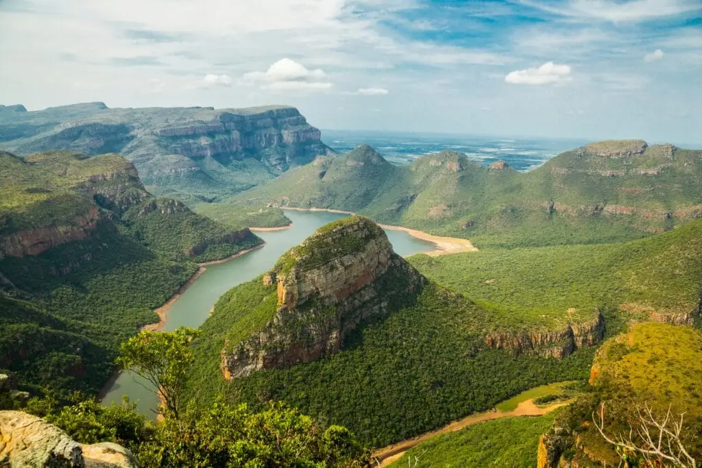 Blyde River Canyon in South Africa with green valleys and winding river, a scenic safari destination