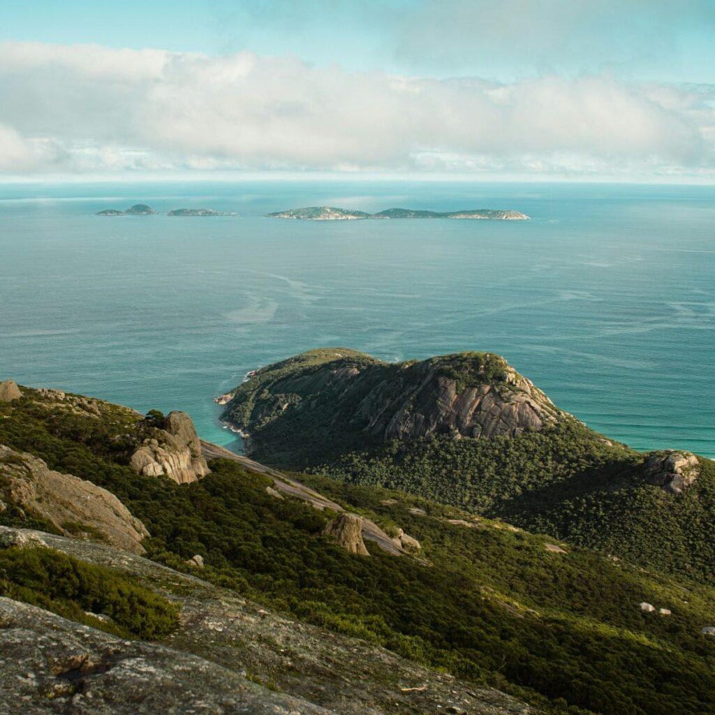 Rocky coastline and ocean view in Oceania with islands in the distance