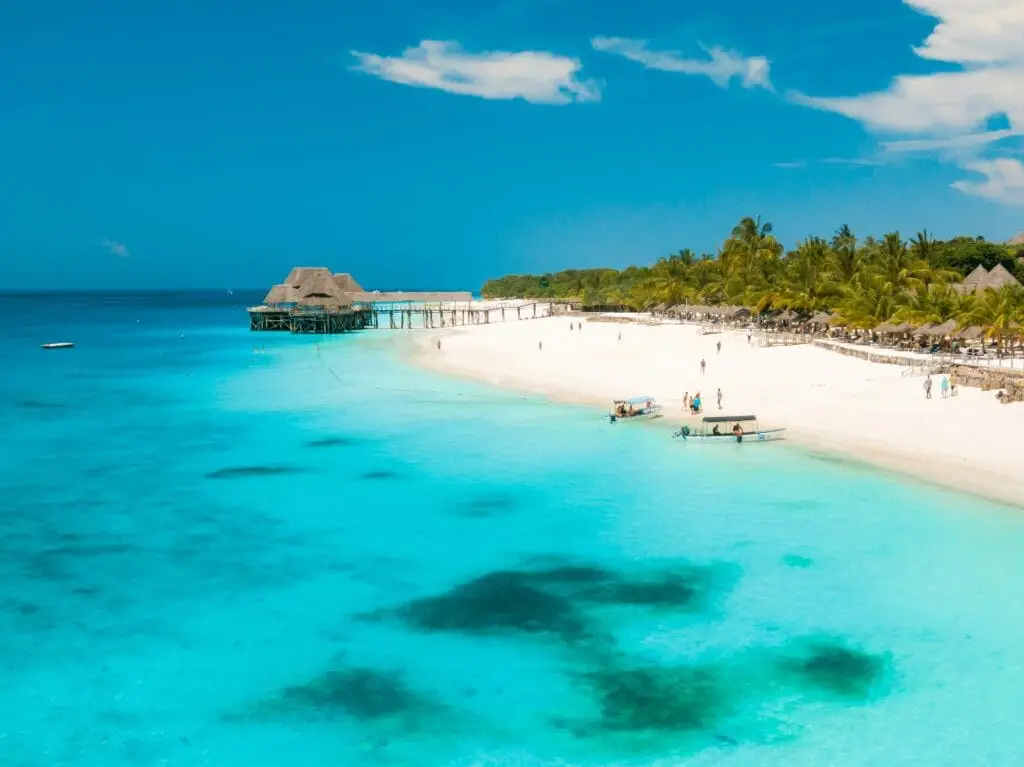 Zanzibar beach in Tanzania with turquoise waters and white sand, a popular safari add-on destination