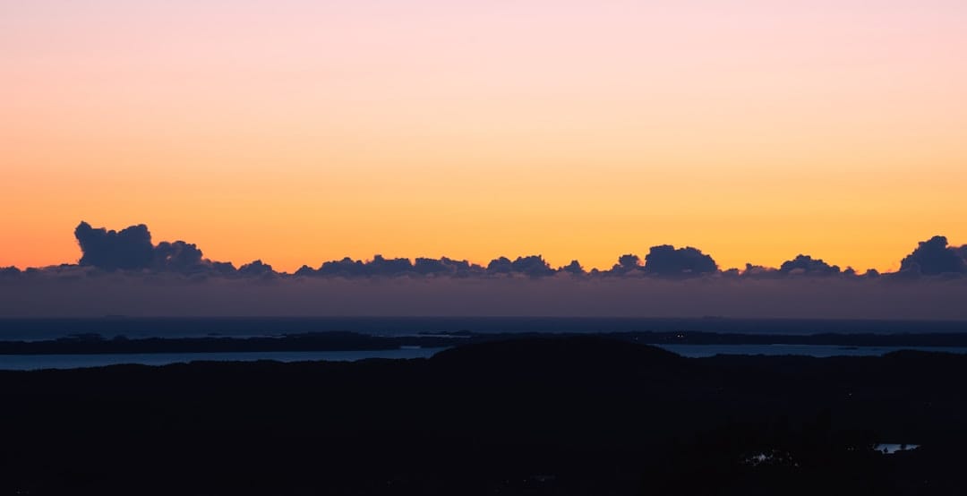 sunset at african lion safari canada with tour bus silhouette