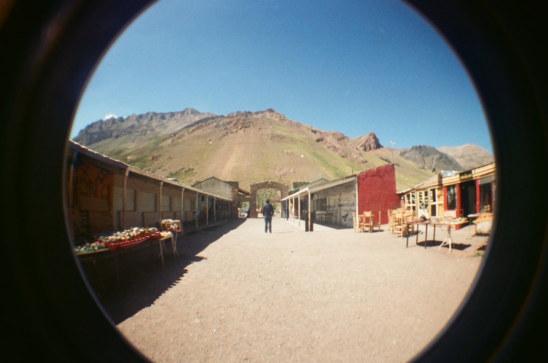 Natural Bridge Wildlife Ranch entrance with visitors and safari vehicles buying tickets