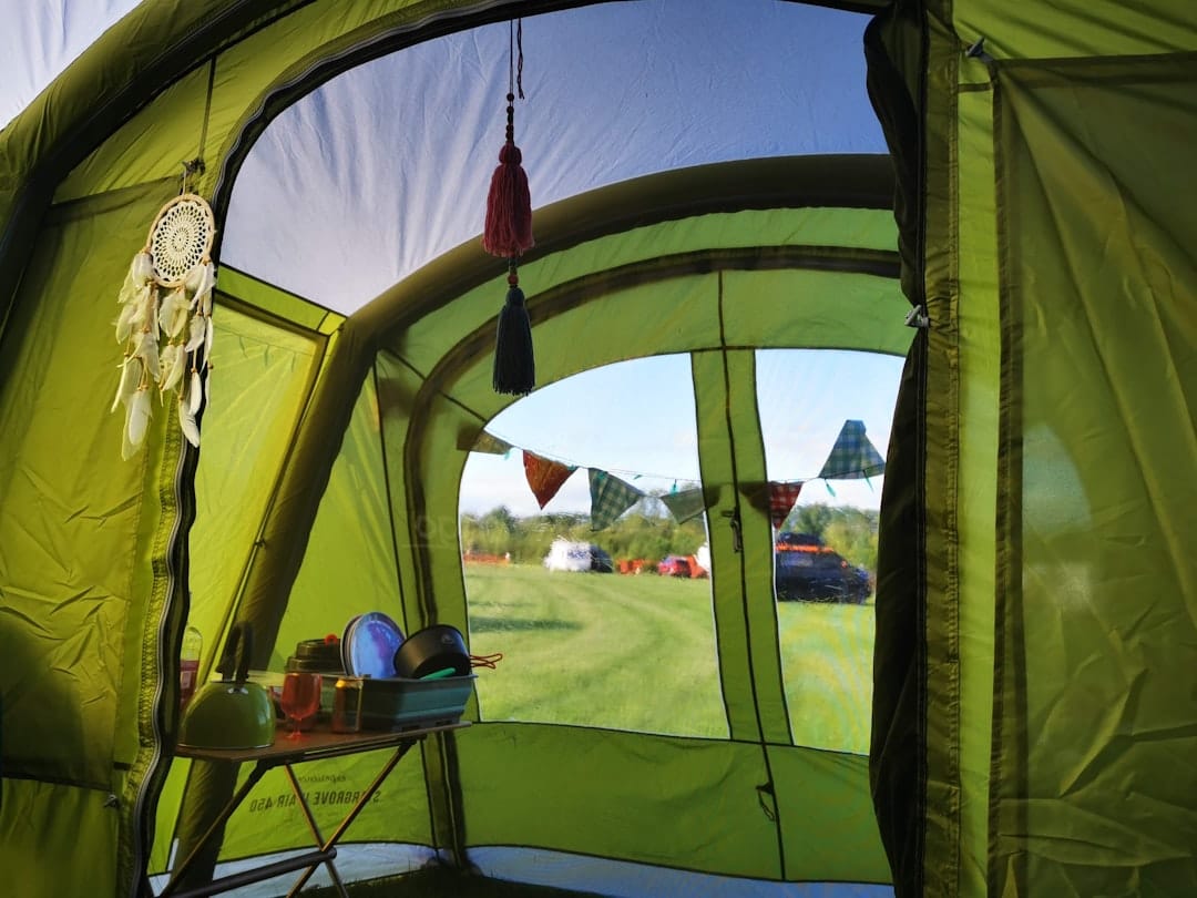 camping cot for wildlife photography at dawn beside tent and tripod