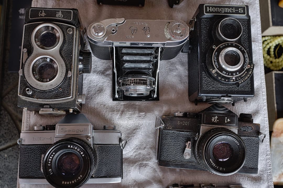 safari packing list photographers gear flat lay with telephoto lenses bean bag and camera bodies