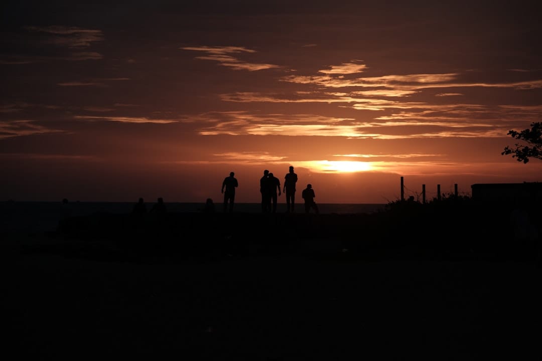 travel photographer in arizona desert at golden hour trail