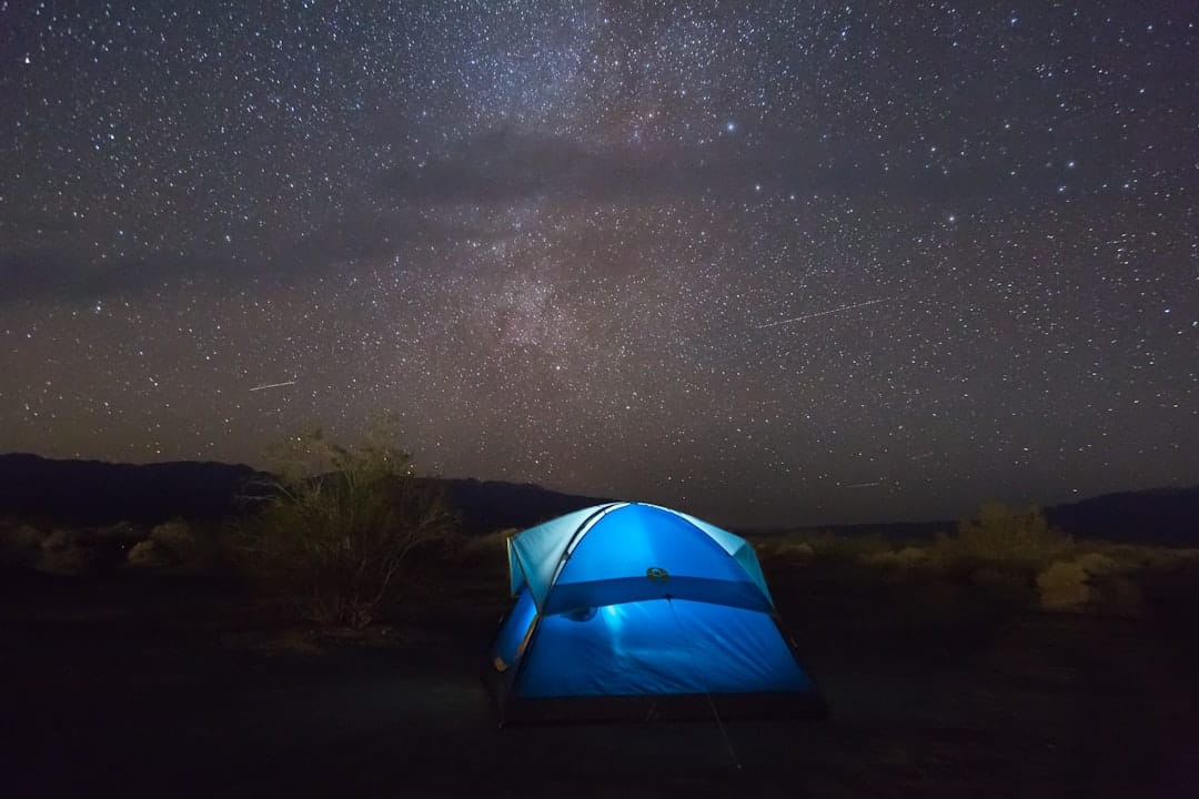 travel photographer night campfire stars ethical wildlife travel