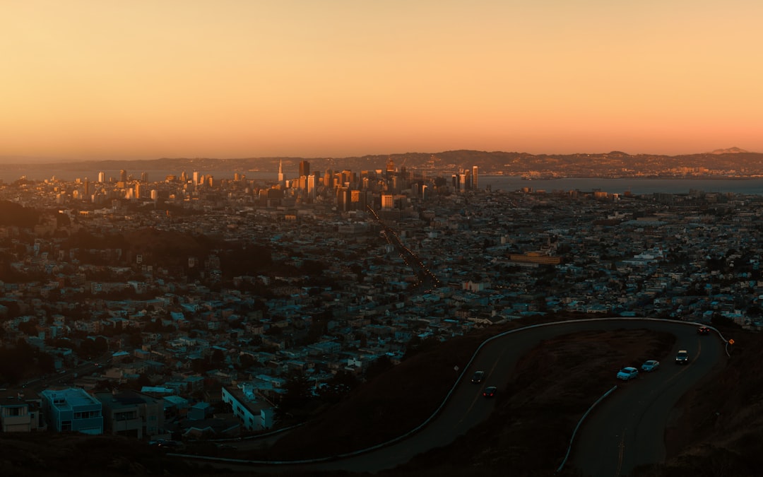 view of san francisco skyline from don edwards national wildlife refuge with reflective water at dusk