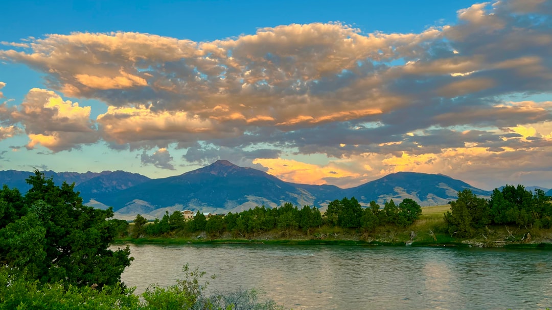Photographer capturing the best places to visit in Montana at sunset.