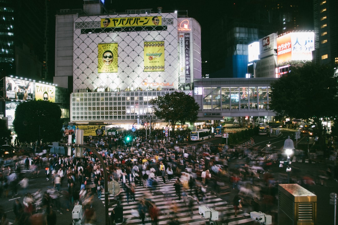Wide angle view of Shibuya Crossing at night for a Tokyo travel guide.