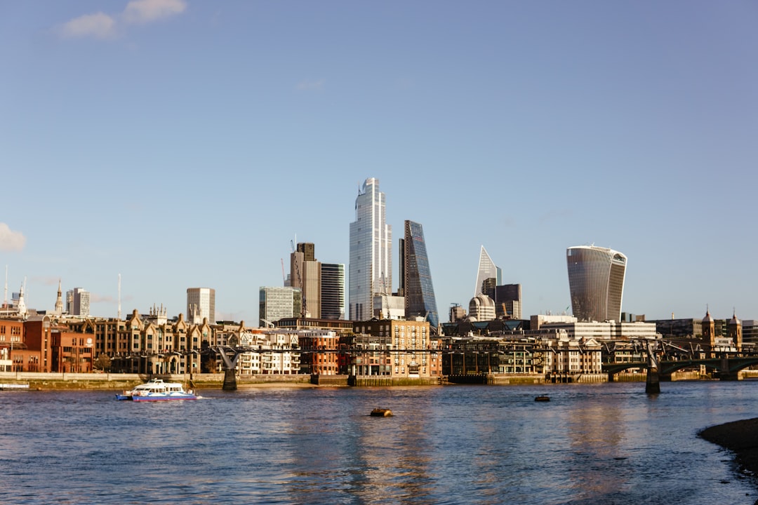 Panoramic view of the London skyline and River Thames during blue hour for a London travel guide.
