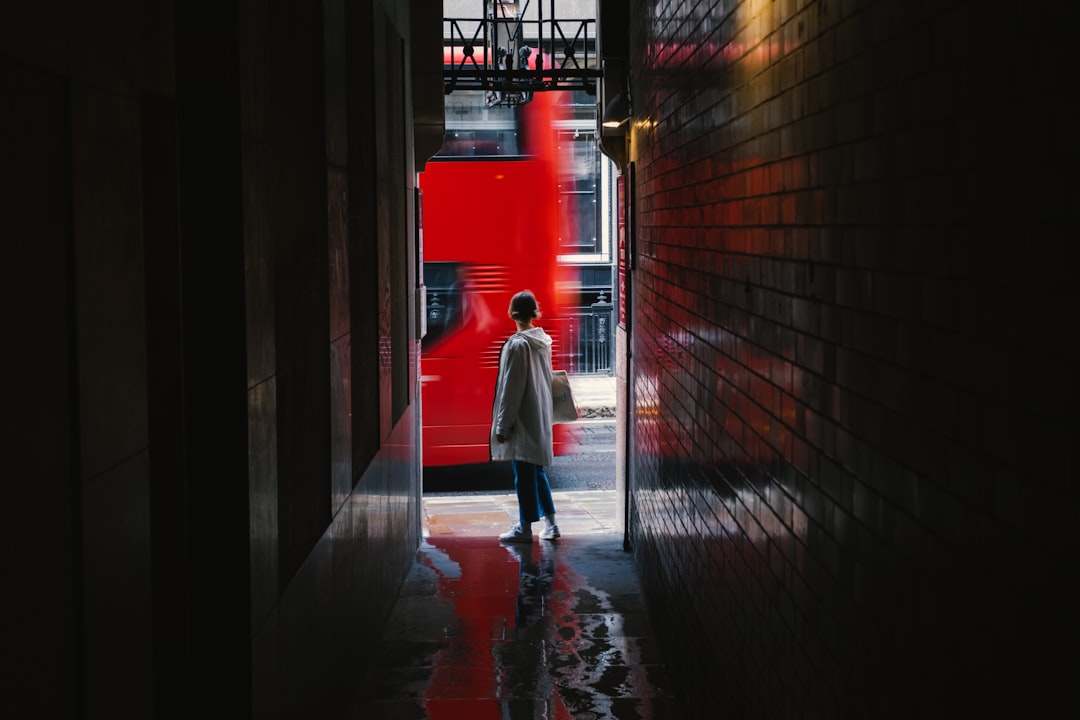 Iconic red telephone booth on a London street, a key highlight in any London travel guide.