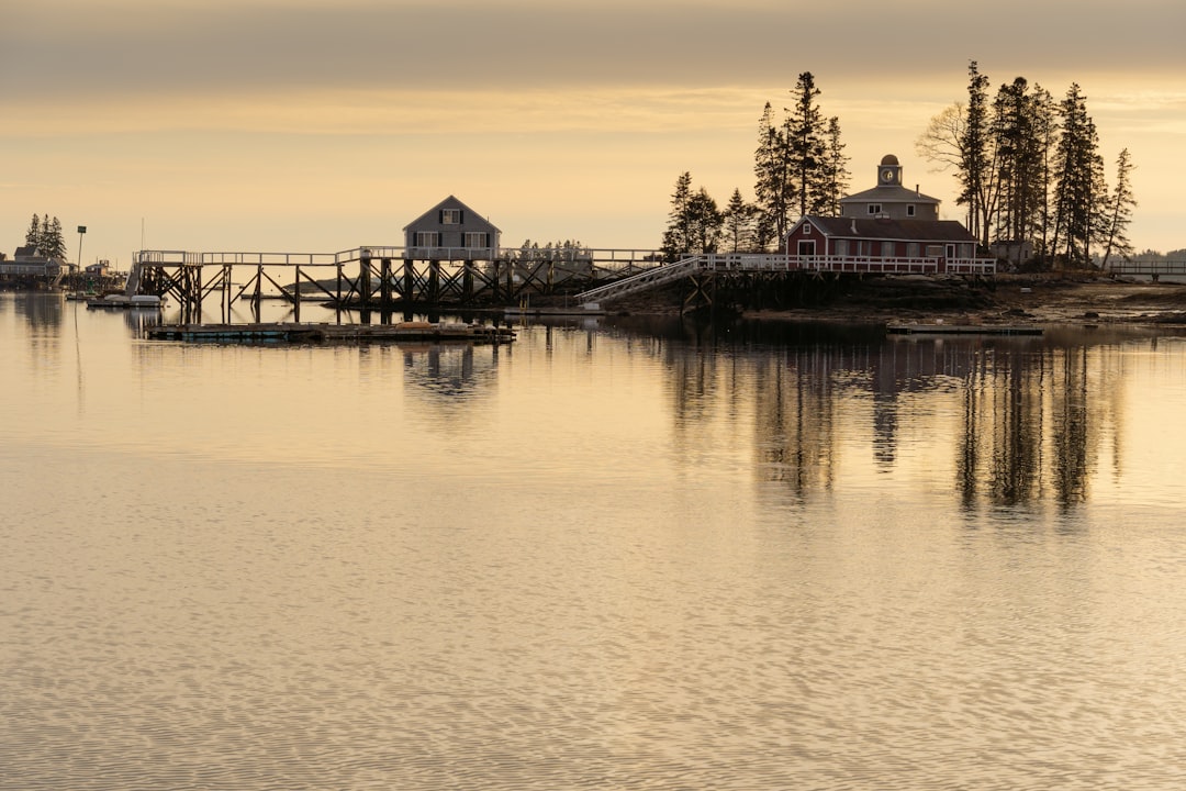A lobster boat in a peaceful Maine harbor for travel photography.
