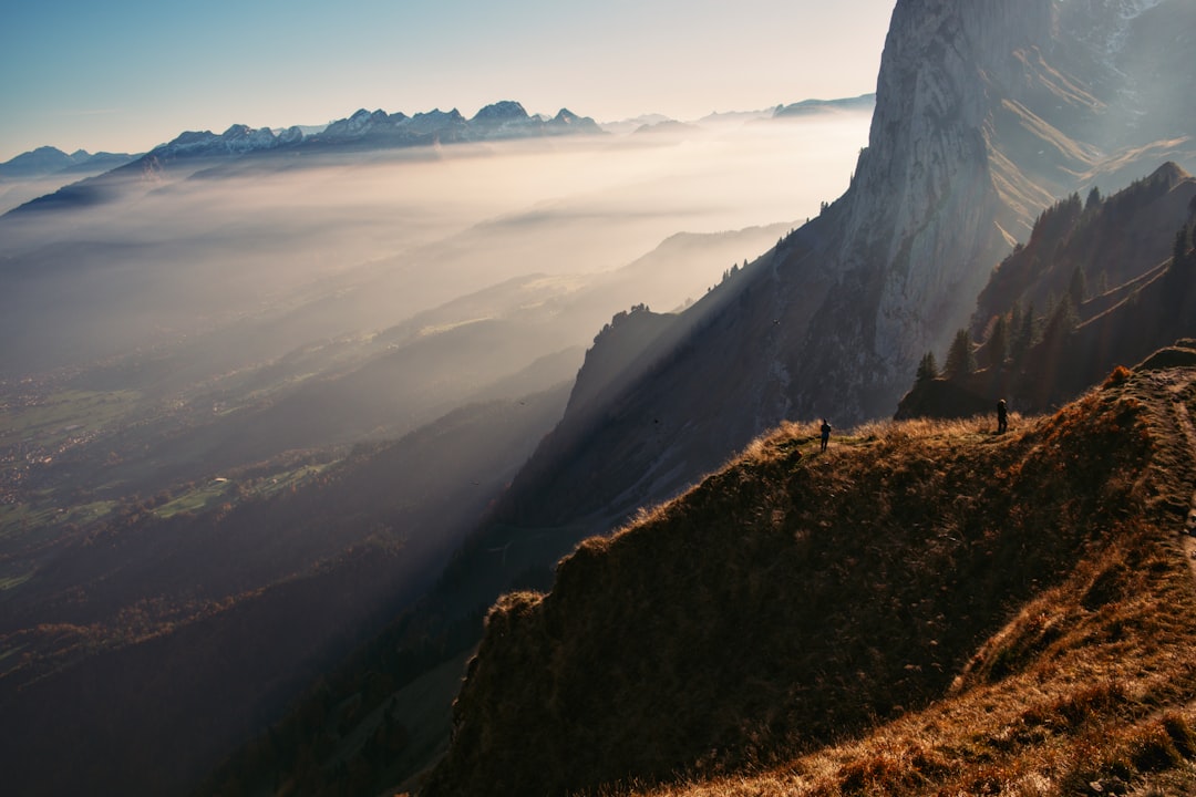 Misty mountain peaks in Switzerland for travel photography europe.